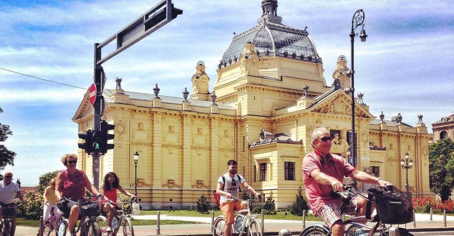 Best of Zagreb: 4-Hour Cycling Tour - Upper Town stories: the noon cannon, Bloody Bridge, and the Stone Gate