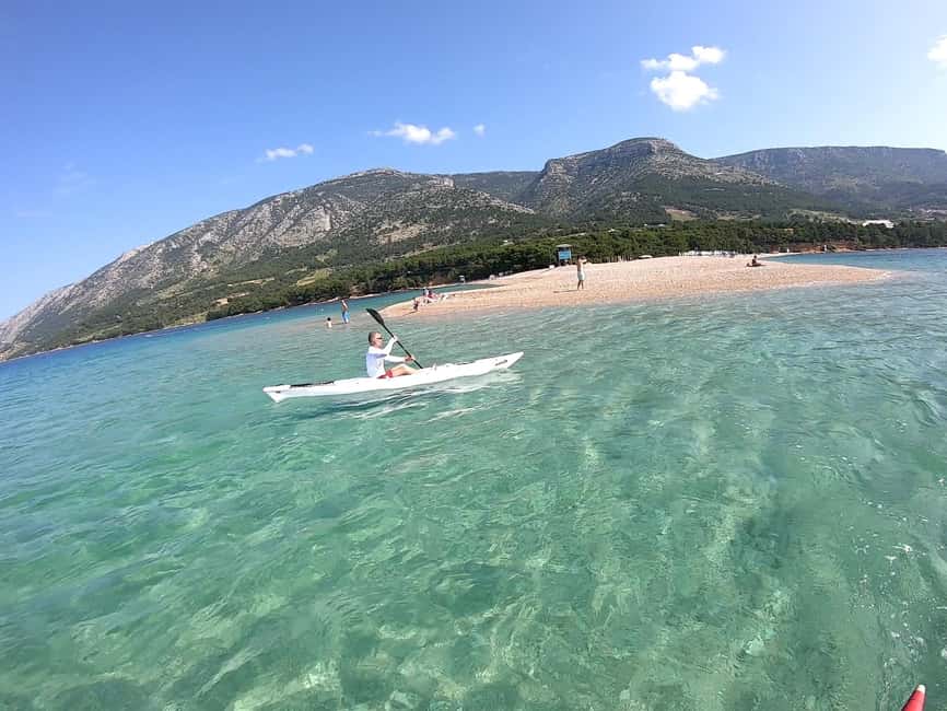 Bol: Zlatni Rat Beach Kayak Tour with Snorkeling - Following the coast to coves and caves