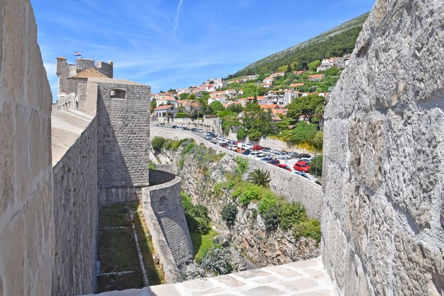 Dubrovnik: City Walls Early Morning or Sunset Walking Tour - Walking the walls above the terracotta roofs
