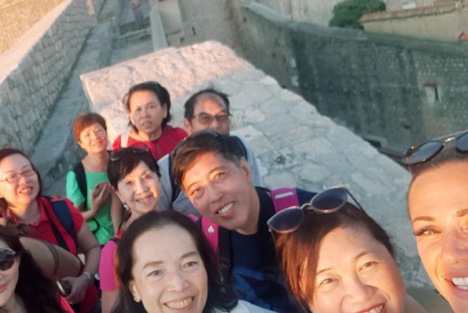 Dubrovnik City Walls Sunset Guided Tour - Starting outside Pile Gate with a blue umbrella
