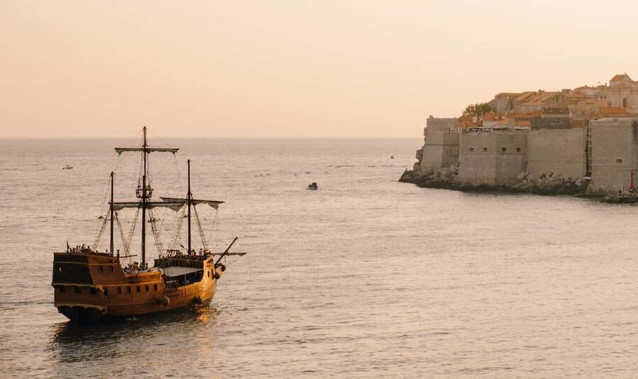 Dubrovnik: Galleon Sunset Cruise with a Live Guide & Drink - The welcome drink and the first view of the city walls