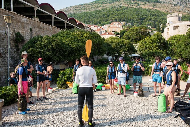 Dubrovnik: Sunset Kayak & Snorkel Tour with Wine & Water - Returning beside Dubrovnik’s Old Town