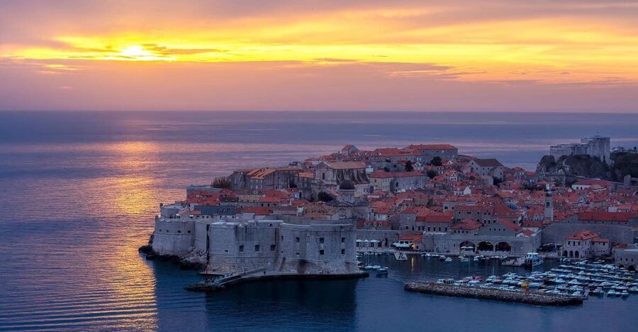 From Dubrovnik: Golden Hour Sunset Cruise with Free Drinks - Seeing Dubrovnik’s walls from the sea