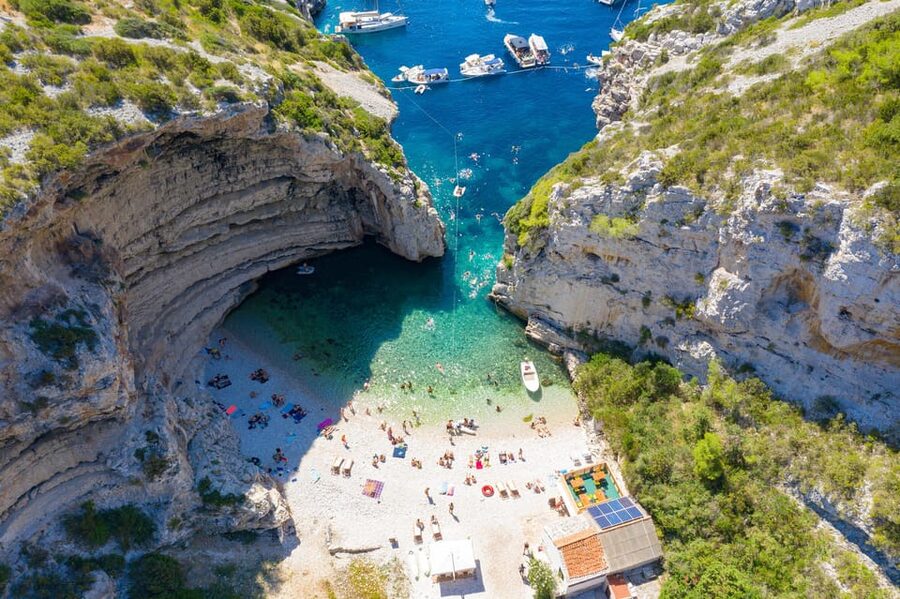 From Hvar: Blue cave group speedboat tour full day - Stiniva Cove is best seen from the water