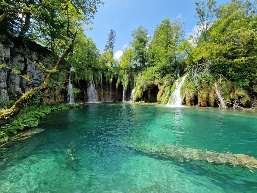 From Zadar: Plitvice Lakes Day Trip with Guide and Boat Tour - The electric boat and panoramic train