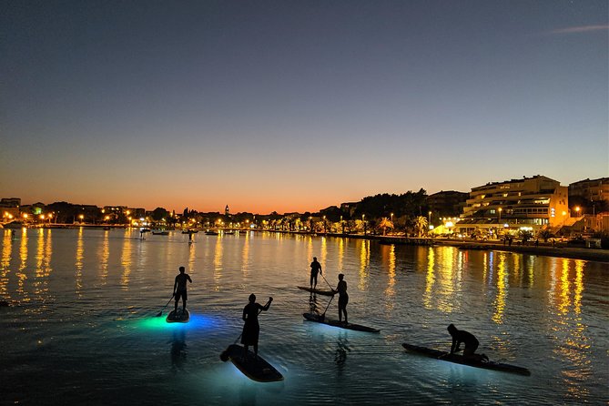 Glowing Stand-Up Paddle Experience in Split - White rocks, cliffs, and traditional houses
