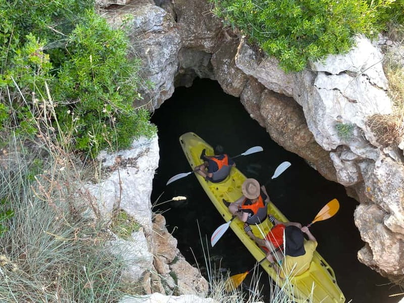 Pula: Cave Kayak Tour, Snorkeling and Island Jumping - Entering the pigeon cave
