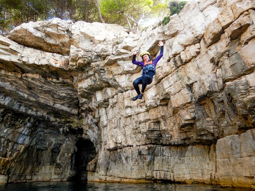 Pula: Coasteering Adventure with Guide and Photos - Swimming, scrambling, and the first low jumps