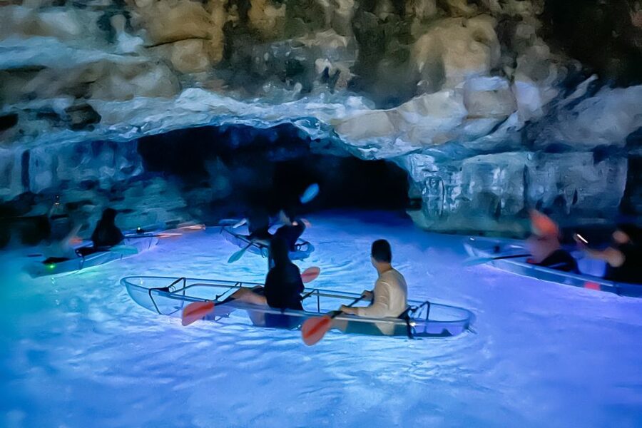 Pula: Night-Time Sea Kayaking Tour in Transparent Kayak - The cave stop and glowing boats