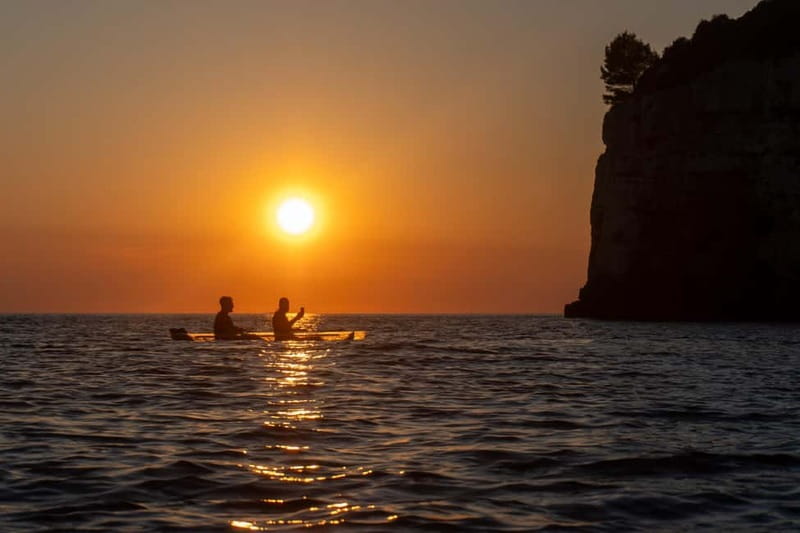 Pula:Sunset Kayak tour with glowing transparent kayak - Why the clear kayak changes the Pula coastline