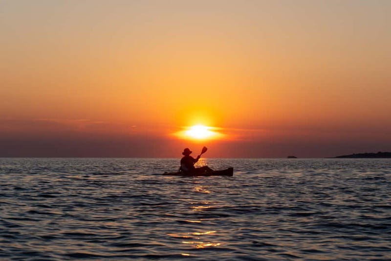 Pula:Sunset Kayak tour with glowing transparent kayak - The Blue Cave from the water