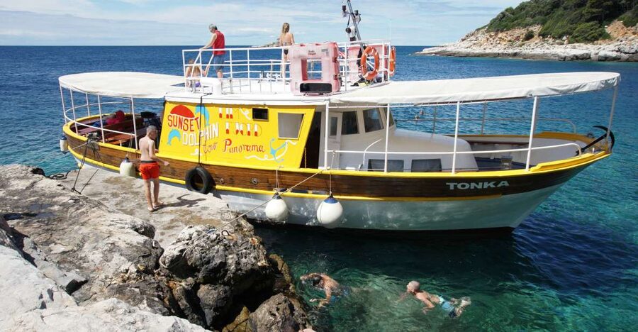 Rovinj Islands Boat Tour with Swimming - Leaving Rovinj with the Old Town in view