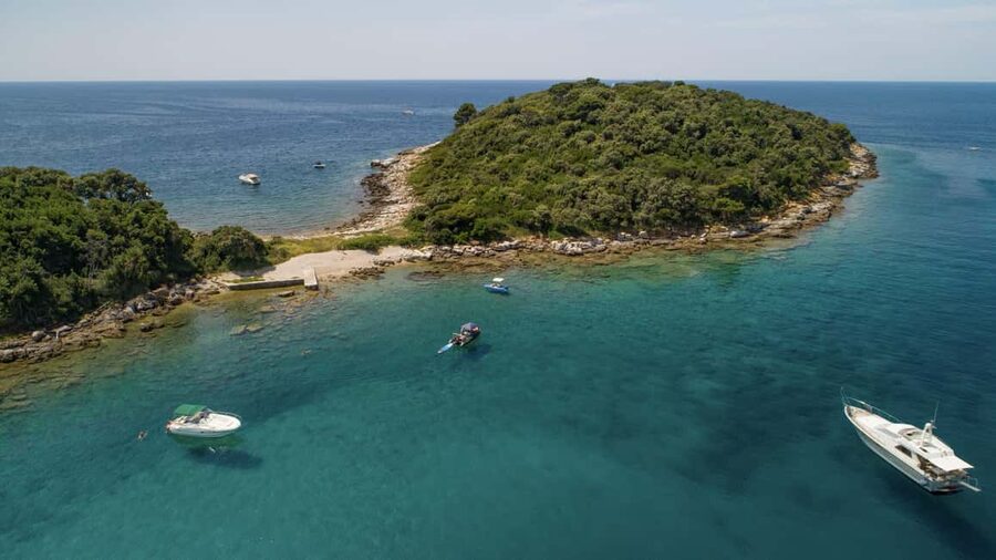 Rovinj: Luxury Island Hopping with Swimming & Snorkeling - The lighthouse and Rovinj old town from offshore