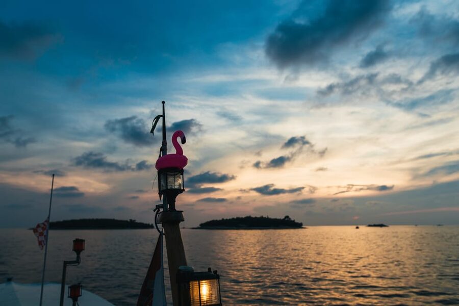 Rovinj: Sunset Cruise with Swim Stop, Drinks, and Fruits - The swim stop between the islands