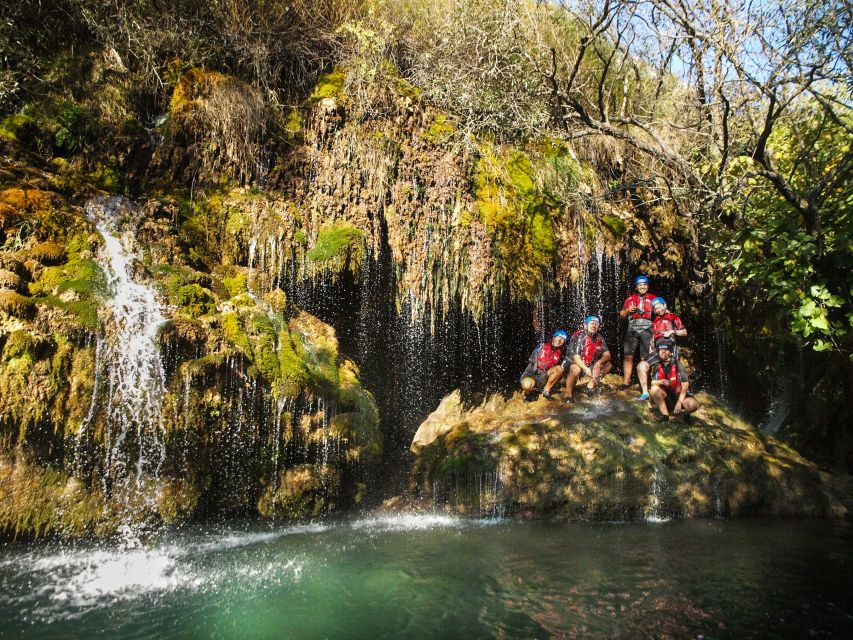 Split: Cetina River Rafting with Cliff Jumping Tour - Swimming into the cave behind the waterfall