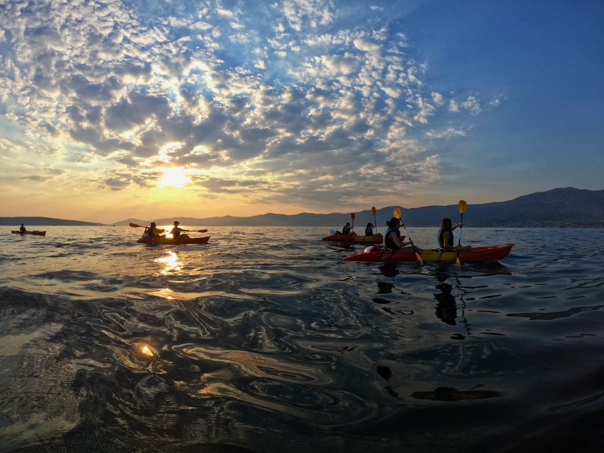 Split: Guided Sunset Sea Kayaking & Snorkeling Tour - A rocky swimming stop with fish below
