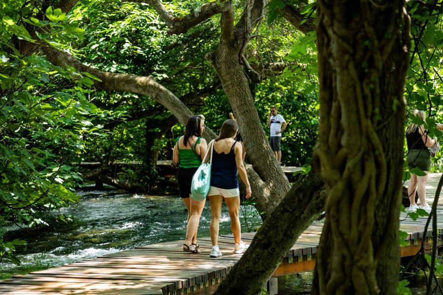 Split: Krka National Park Day Trip with Boat Ride & Swimming - Four hours among waterfalls, mills, and travertine