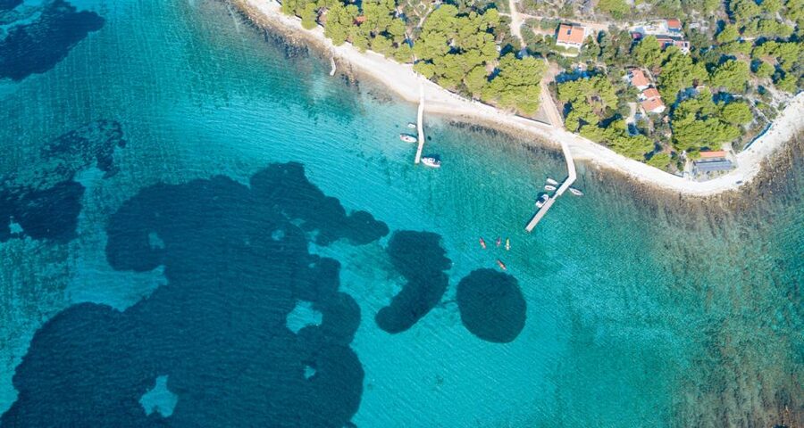 Trogir: Blue Lagoon, Maslinica, and Solinska Bay Boat Tour - Krknjaši Blue Lagoon and its bright water