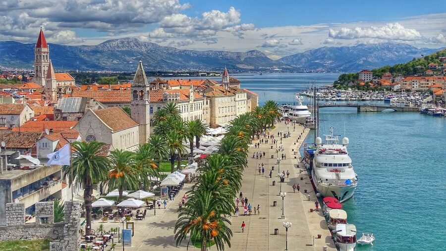 Trogir: Old Town Guided Walking Tour - Walking the promenade beside Kamerlengo Fortress