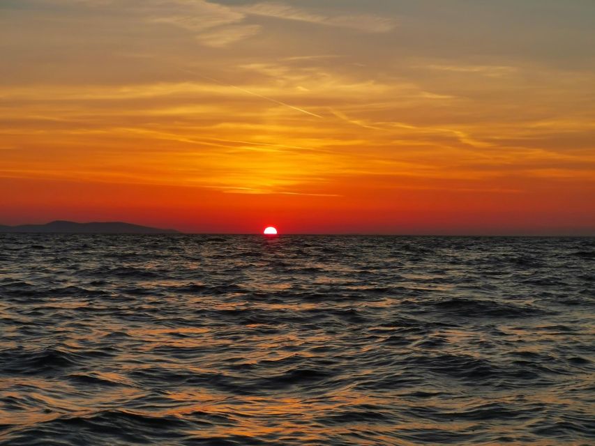 Zadar: Sunset & Nighttime Cruise with Sparkling Wine - Leaving Marina Tankerkomerc as the sun drops